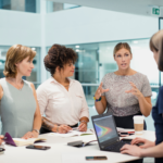 4 businesswomen working in an office space