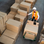 warehouse worker checking inventory with inbound logistics