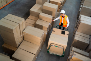 warehouse worker checking inventory with inbound logistics